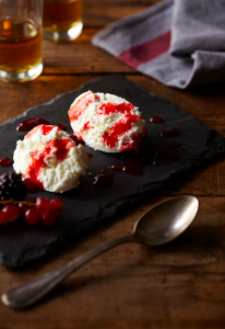 Fresh Mató cheese with wine-spiced cherries
